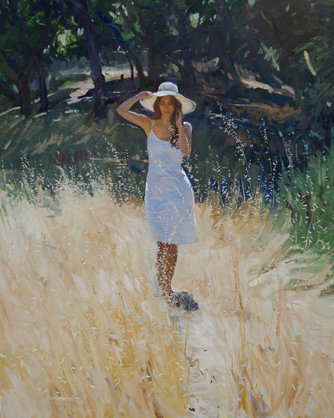 Plein air painting of a model standing in rye grass.
