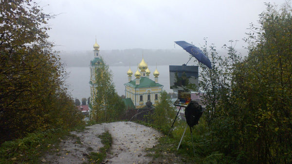 Plein air landscape painting in heavy persistent rain in Plyos, Russia.