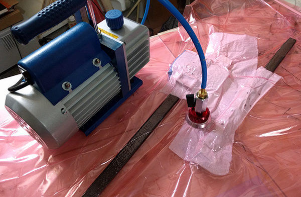DIY carbon fiber painting mast in a vacuum bag.