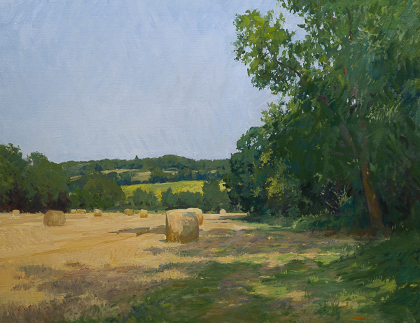 Plein air landscape of hay bales in France.
